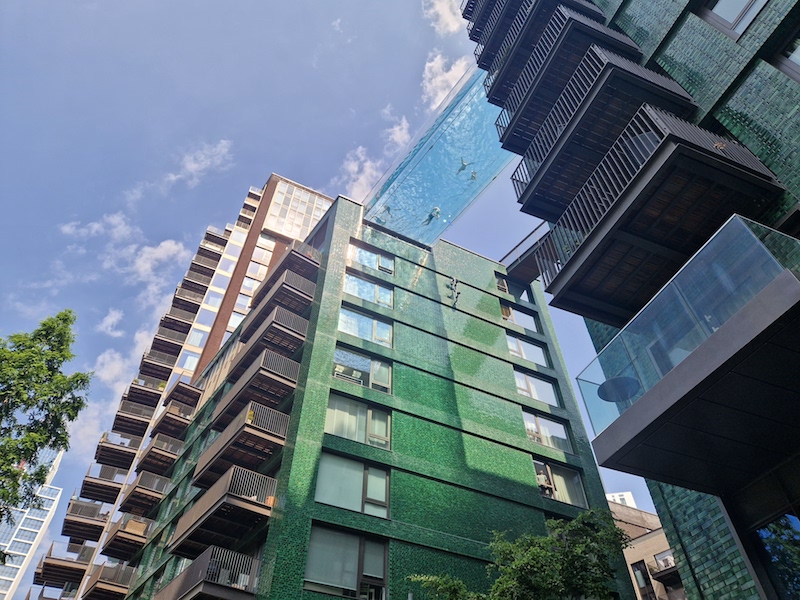 People swimming in sky pool