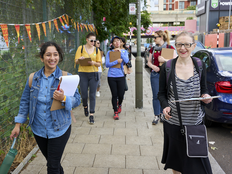 Group of people walking down a street