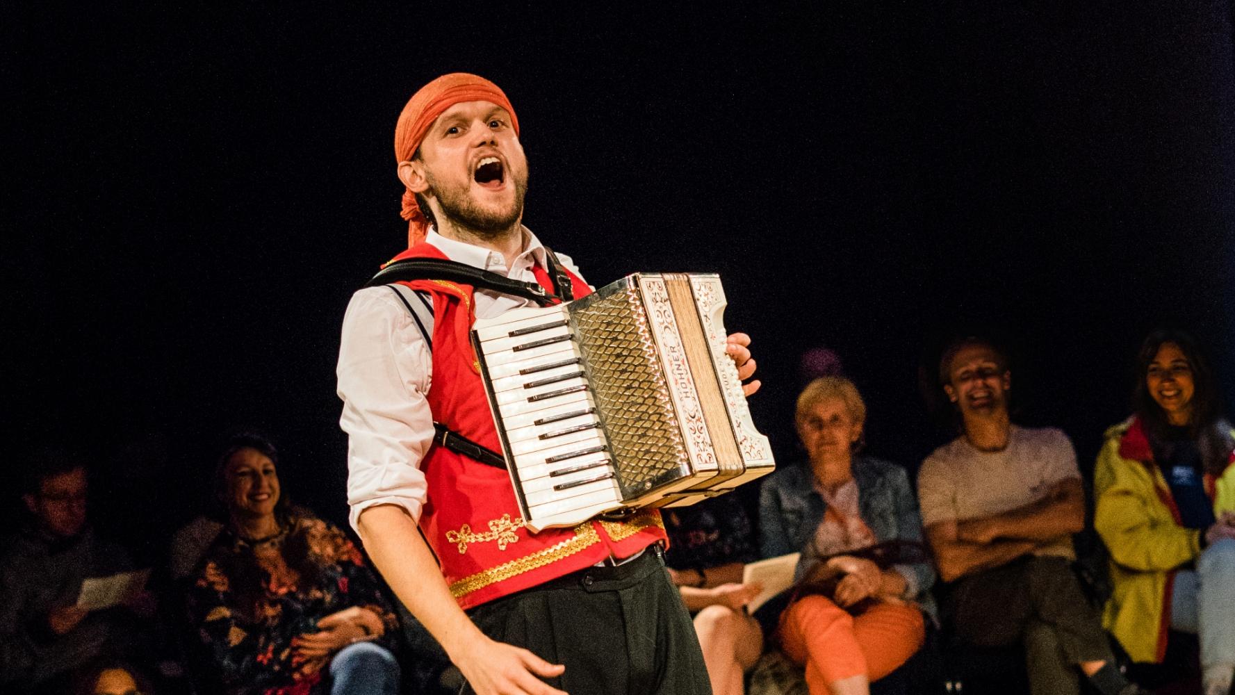 A man dressed as a pirate plays the Accordion