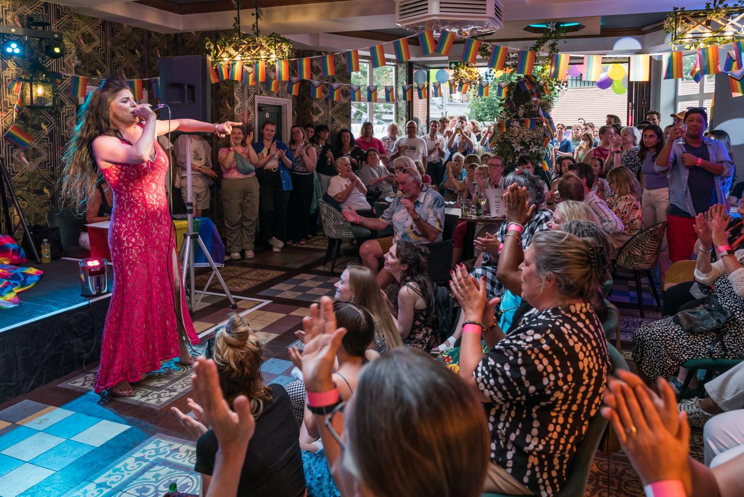 Drag Queen in front of crowd