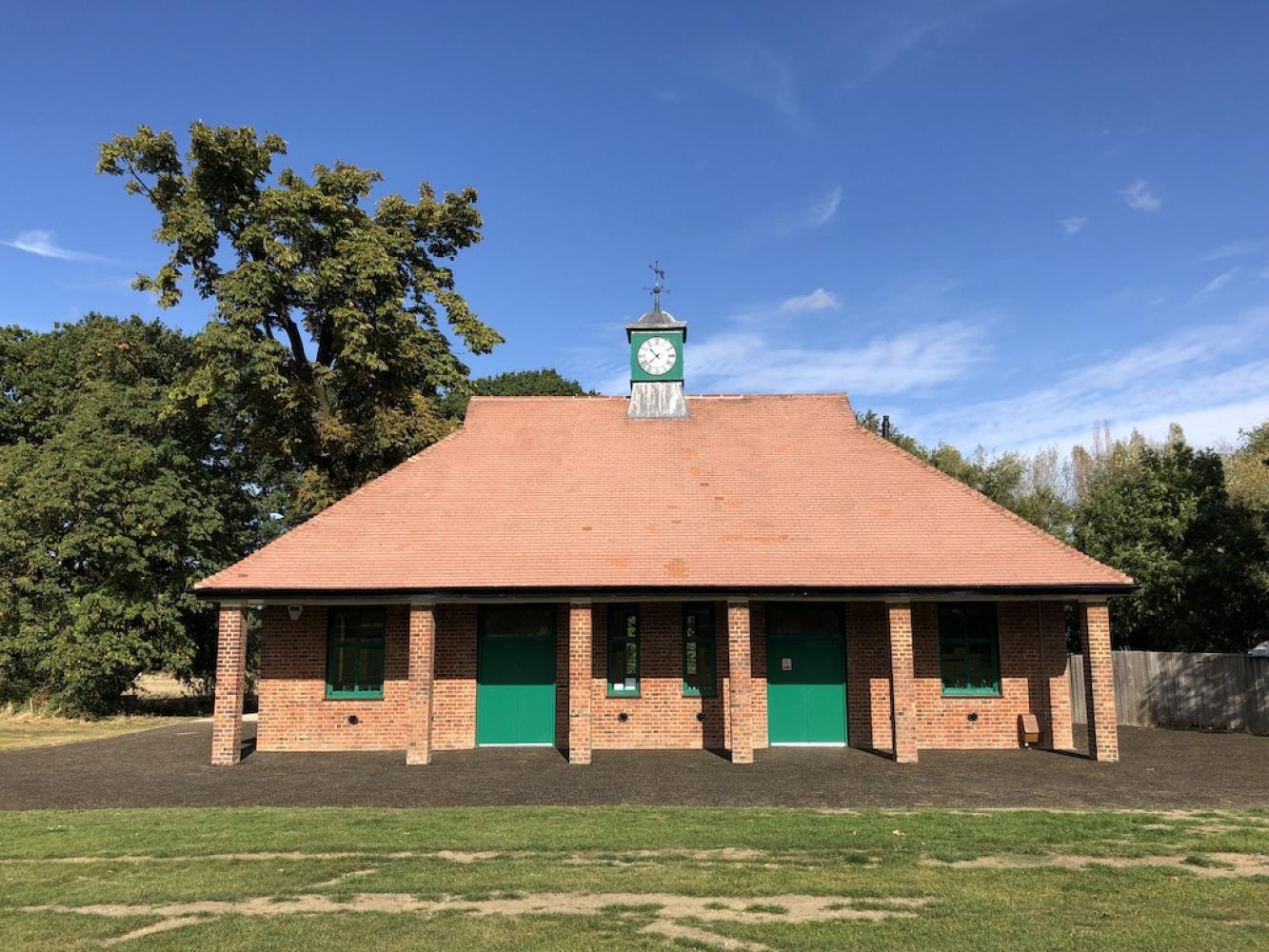 An old building with a clock tower on a sunny day.